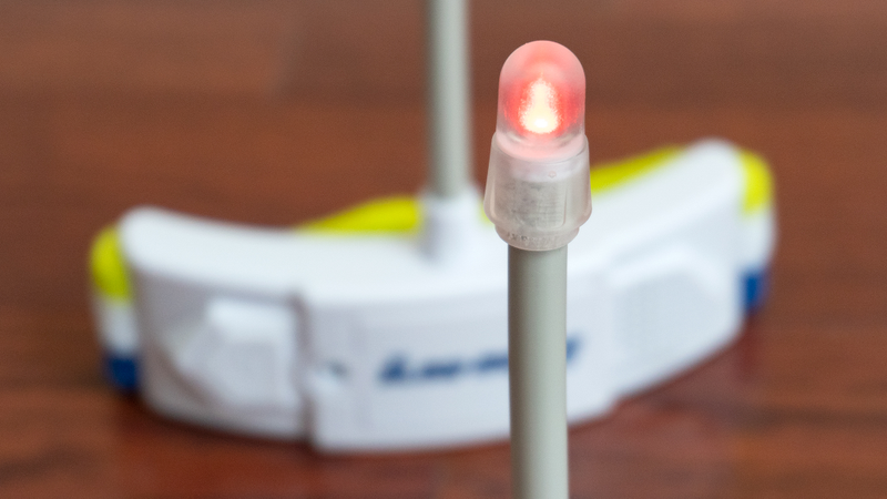 In addition to an audible buzz, a light atop each headband indicates when a play has moved too fast.